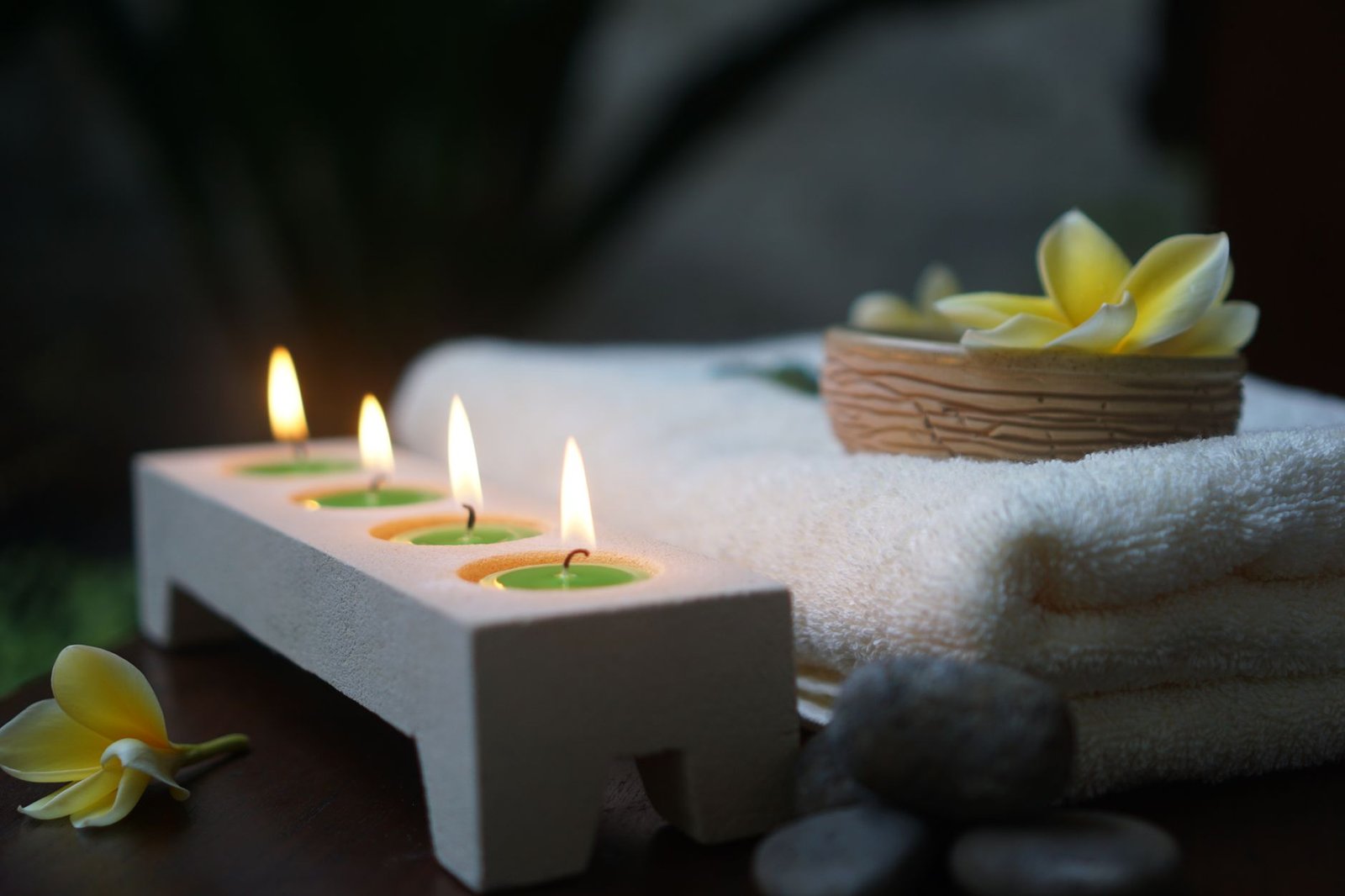 lighted candles on white candle holder