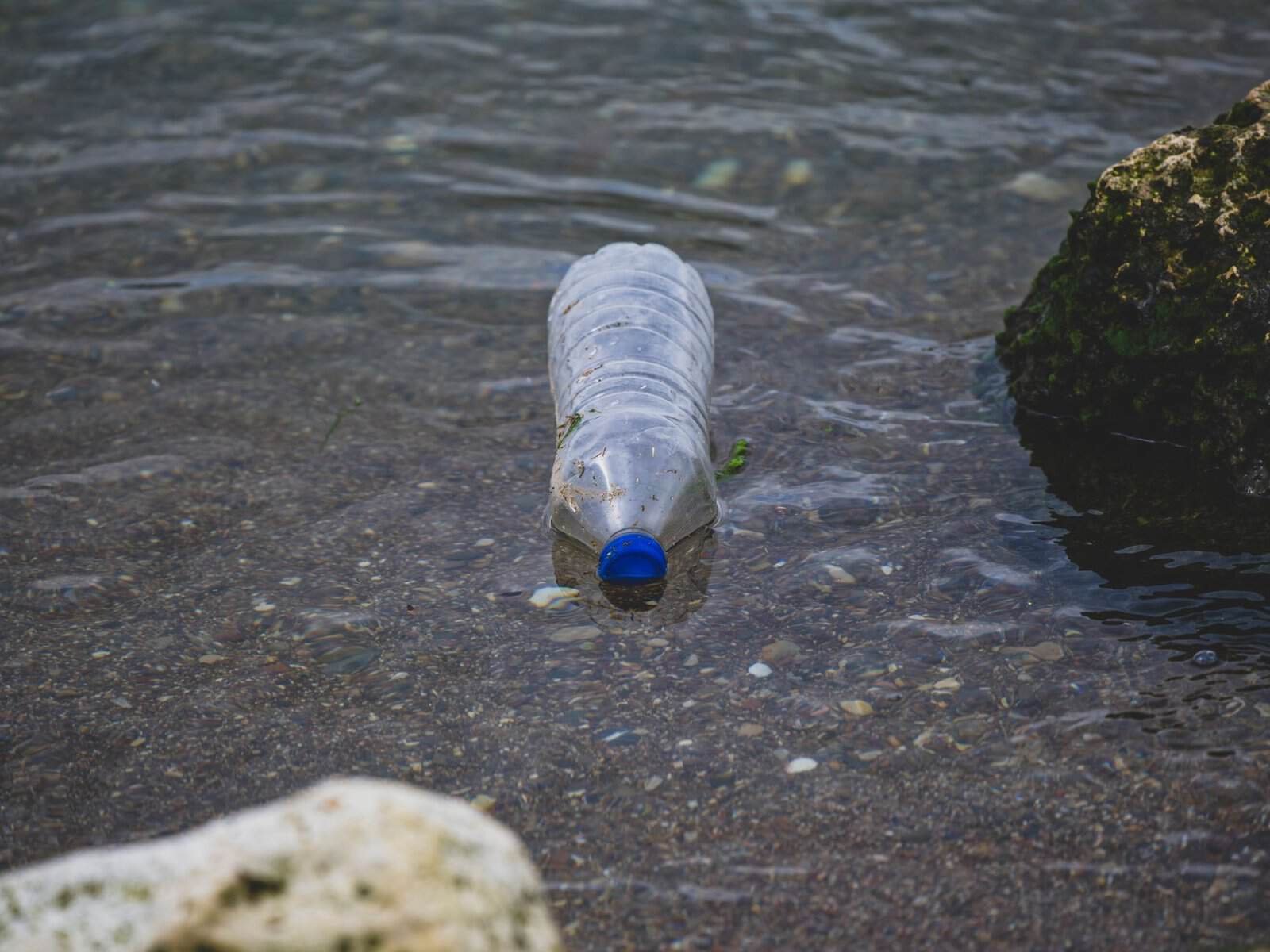plastic bottle pollution in natural waterway