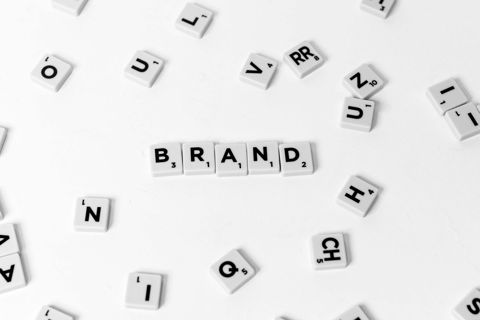 word from white and black scrabble tiles