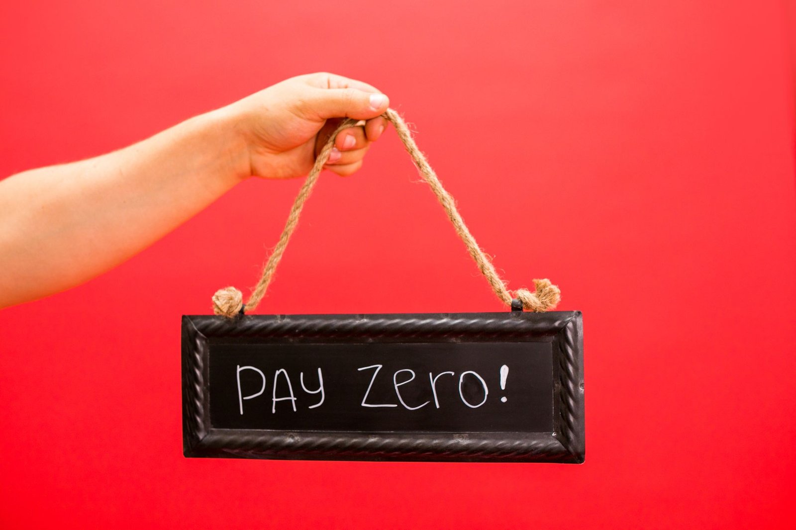 a person holding a hanging signage