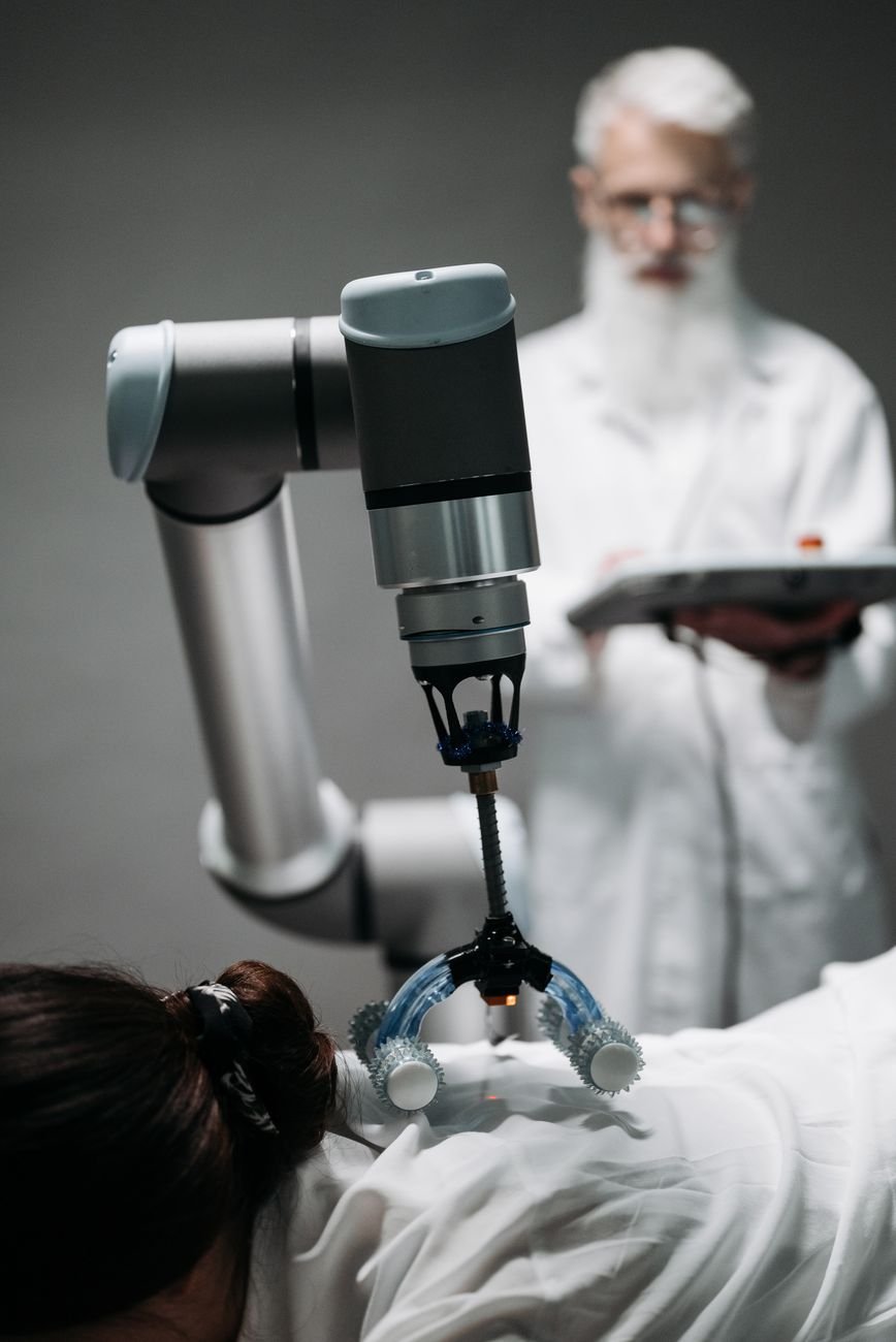 a bearded man controlling a robot