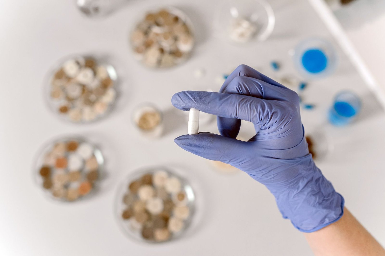 hand in glove holding medicine