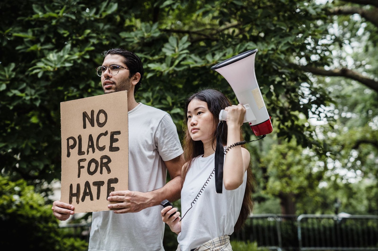 protesters holding cardboard and megaphone